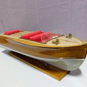 Wooden model of speedboat on stand