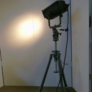 Theater spotlight mounted on a vintage tripod